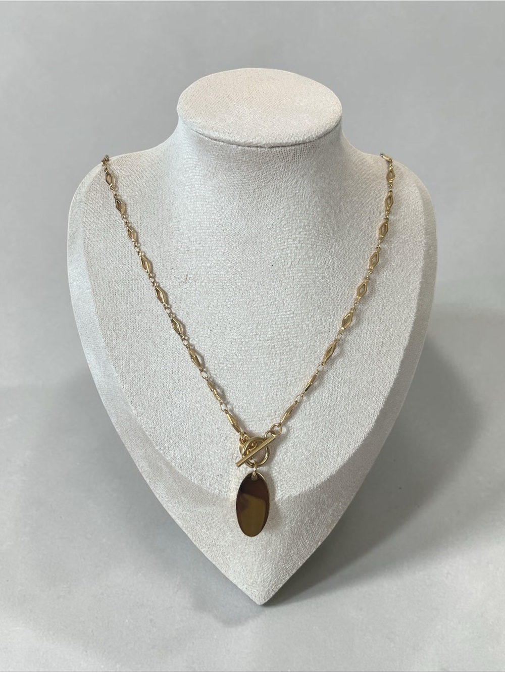 Gold Toggle Pendant Necklace with Gold Oval Charm